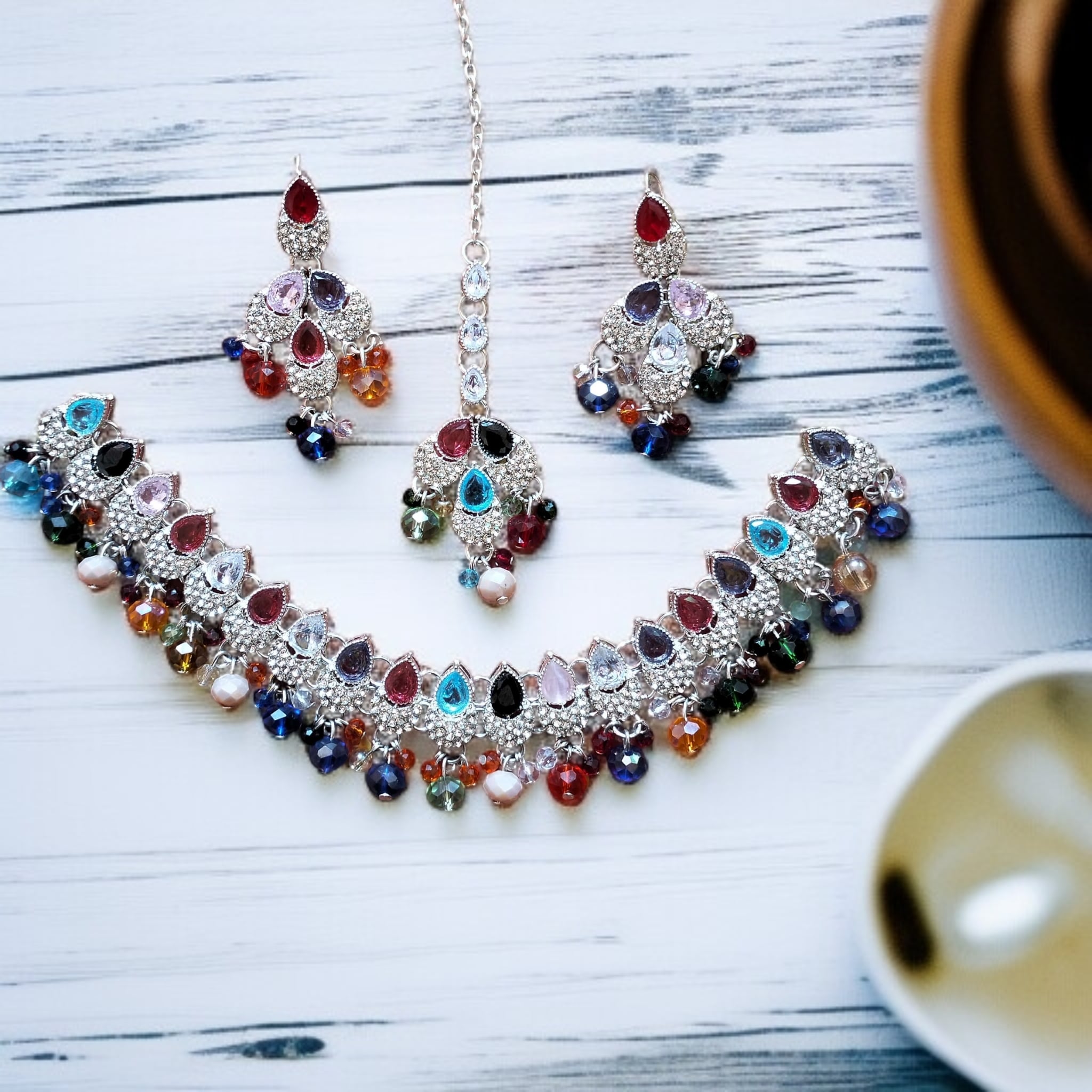 Buy multi colour jewellery set with necklace , earrings and tikka at best price in Pakistan
