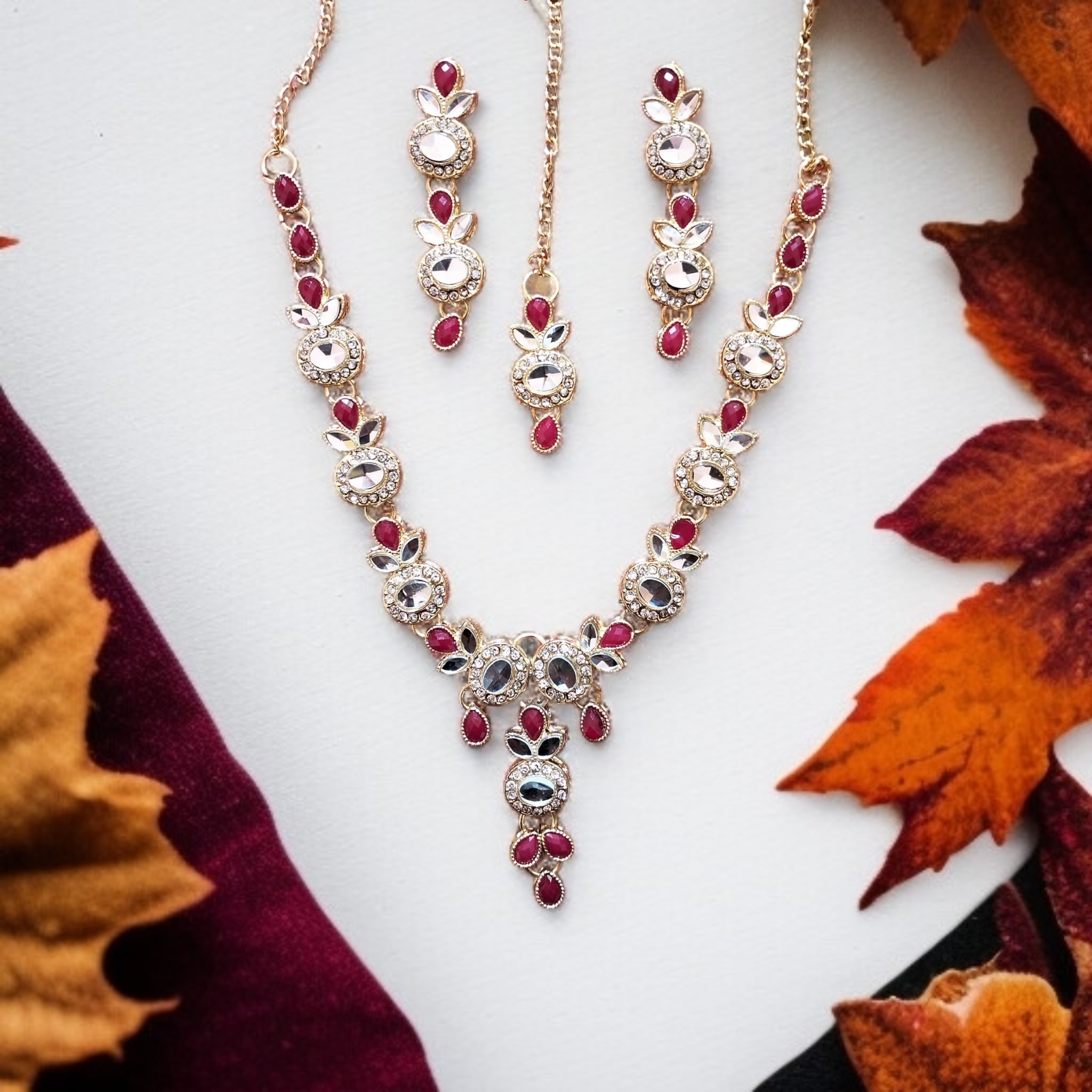 Buy Red and Golden colour jewellery set with necklace , earrings and tikka at best price in Pakistan